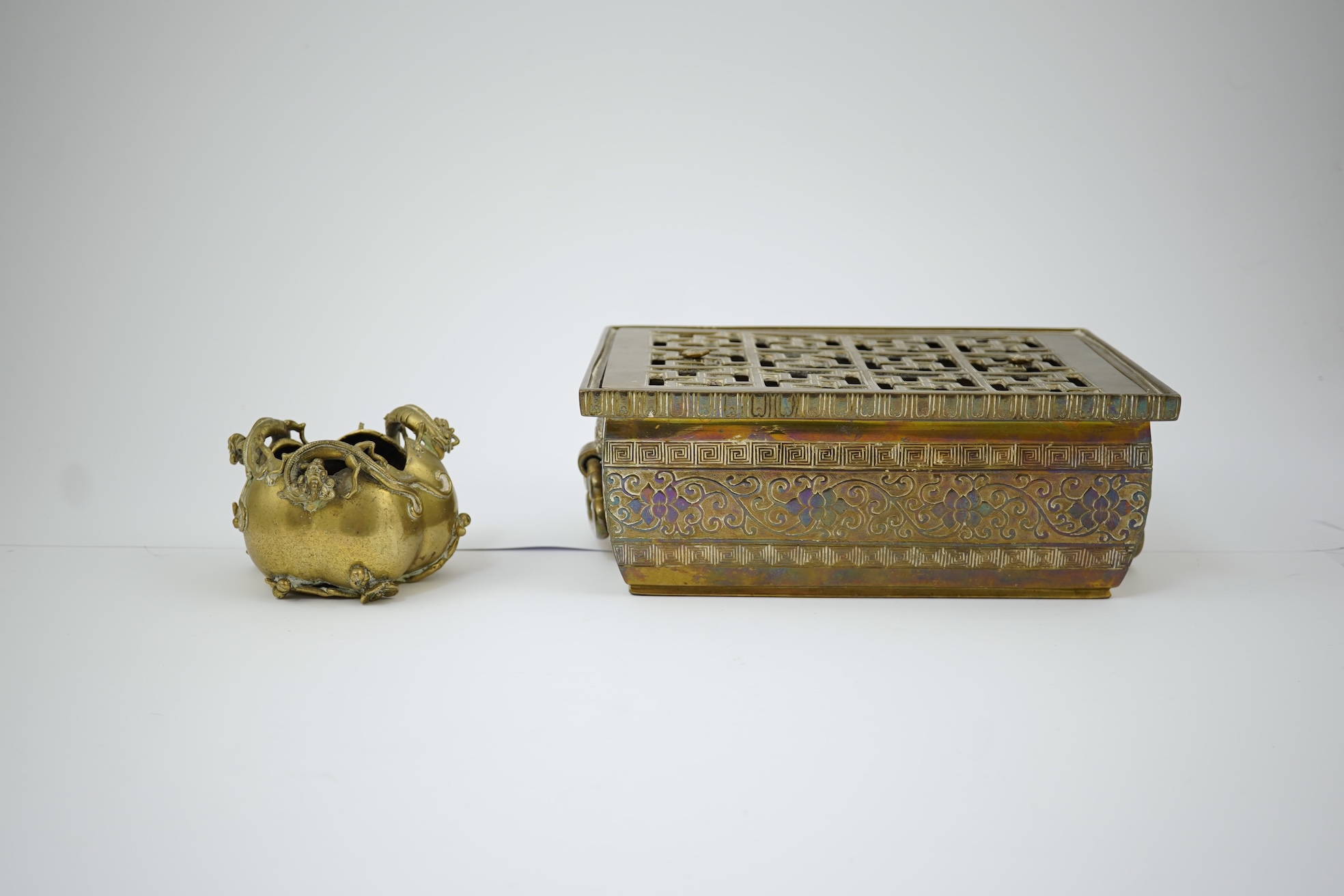 A large Chinese bronze rectangular censer and cover, Xuande seal mark, and a ‘plum blossom and chilong’ bronze censer, both 19th century